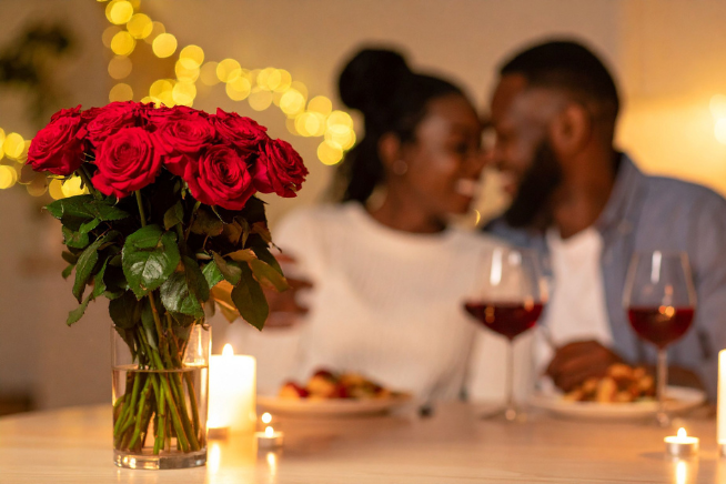 Couple enjoying a date night in with roses