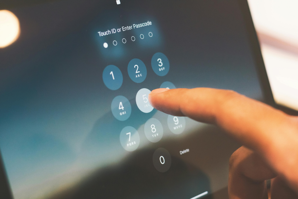 Someone typing in a password on an iPad