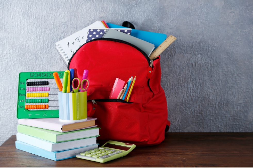 School supplies including stationery, a backpack, a calculator and books