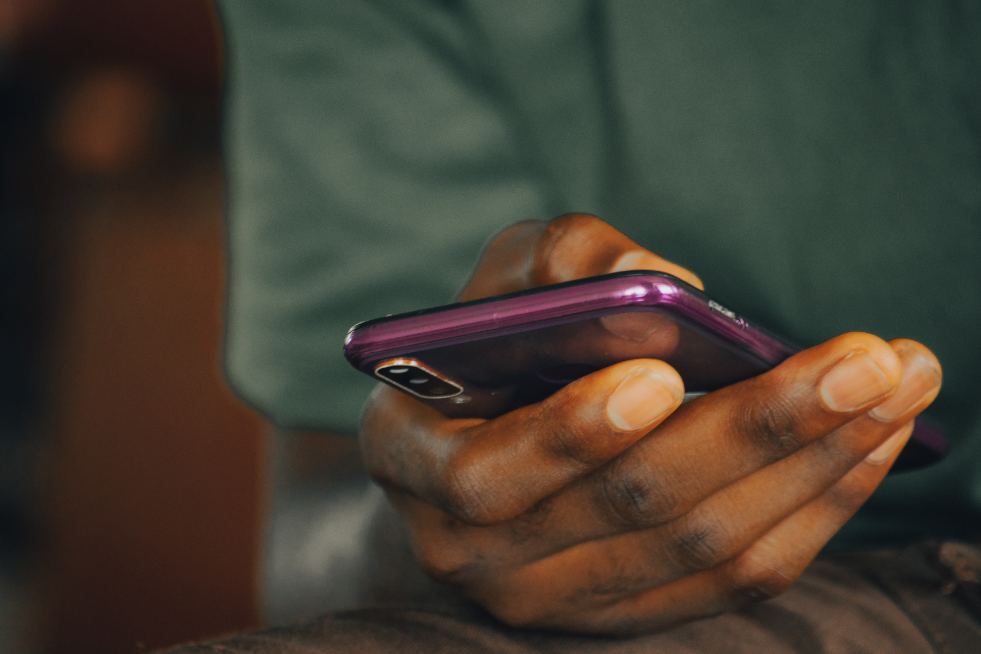 Close up of hands scrolling on a phone