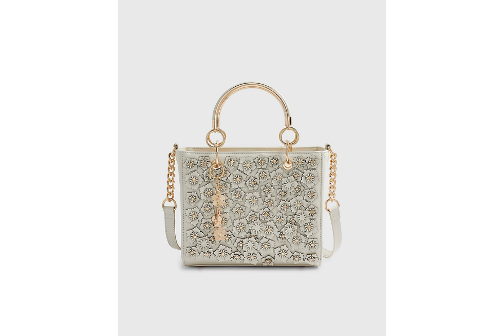 Cream bag covered with applique flowers