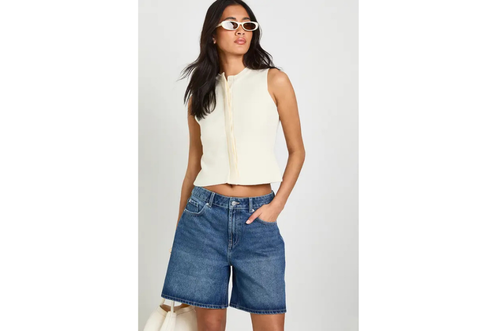 Model wearing boyfriend denim shorts