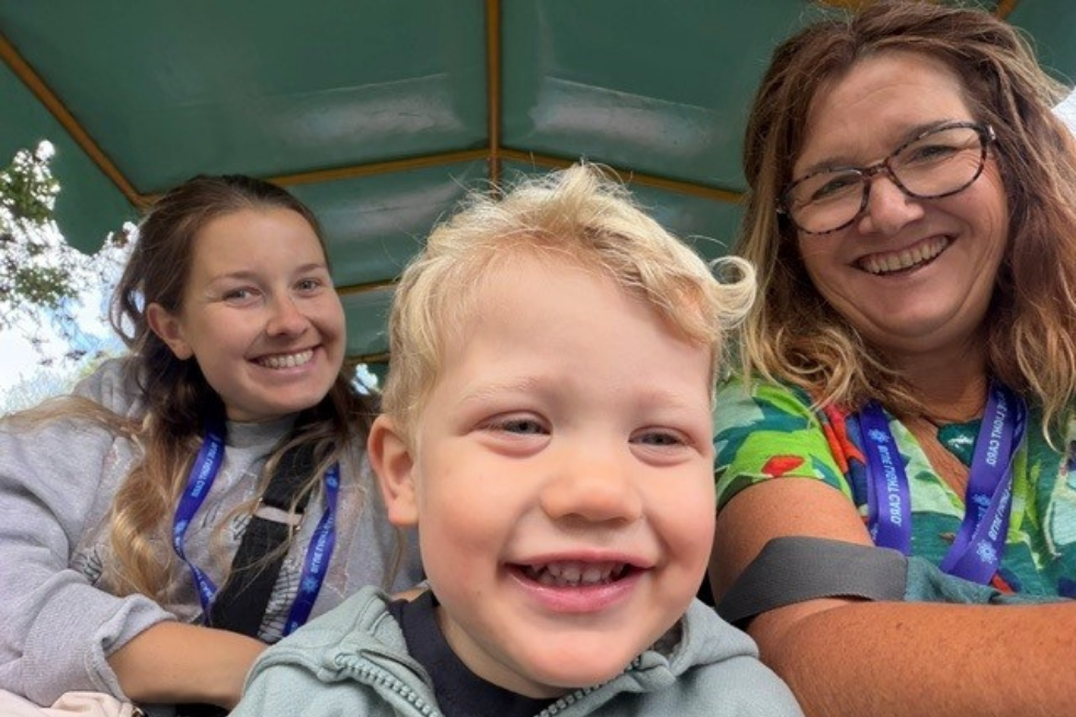 Family of three smiling
