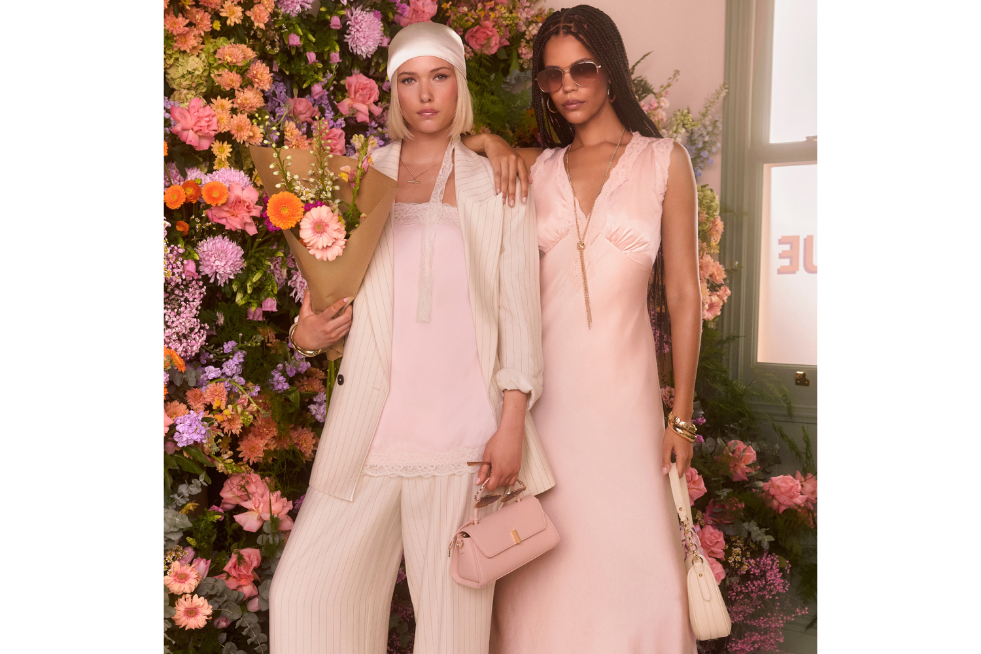 Two women, each wearing New Look clothes in pastel shades against a flowery background.