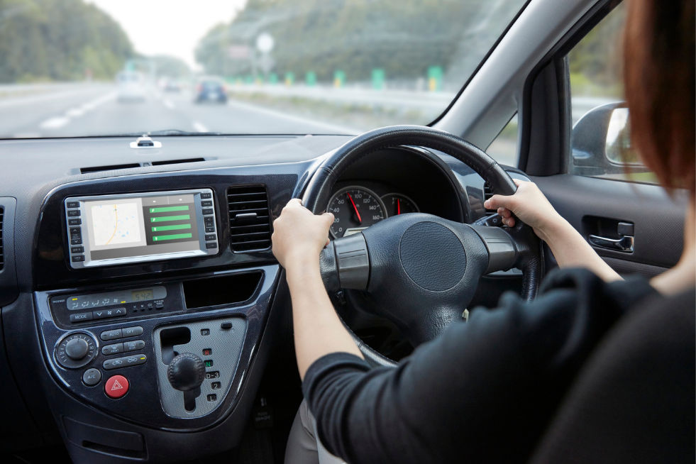 A person driving a car on a motorway