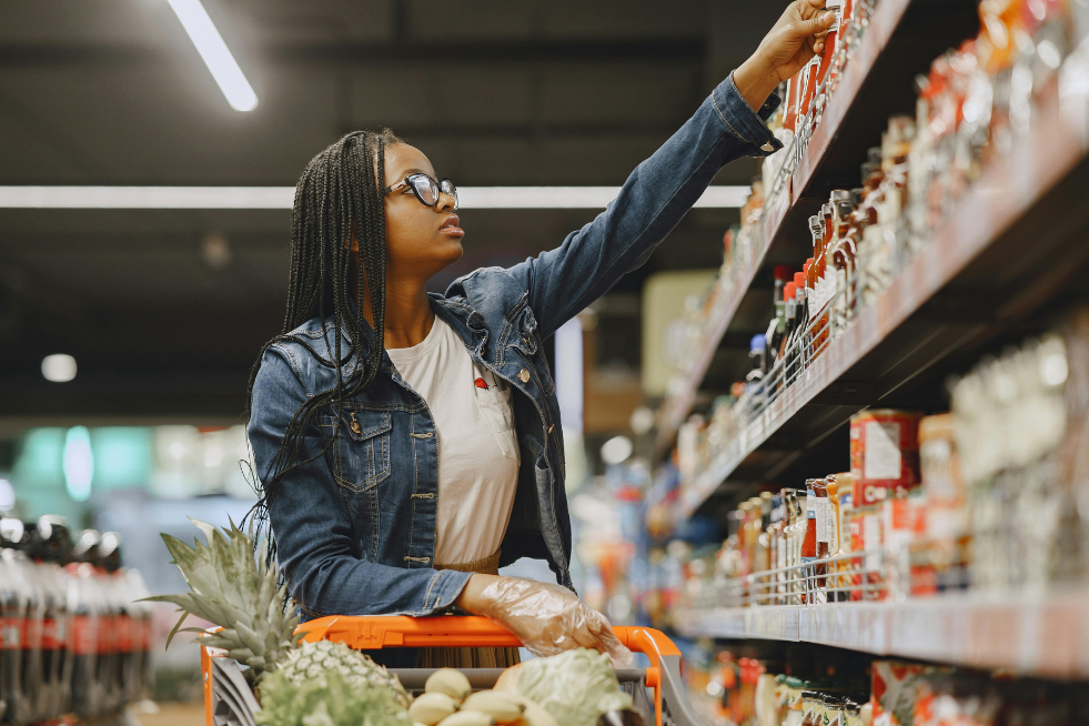 A woman browsing shelves in a supermarket