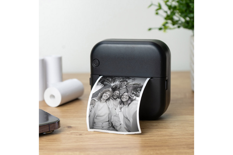 Black printer with photo coming out