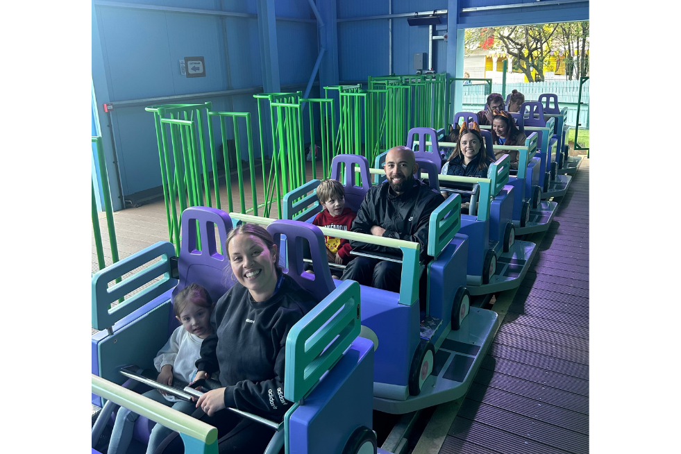 Members sat on the Bluey rollercoaster