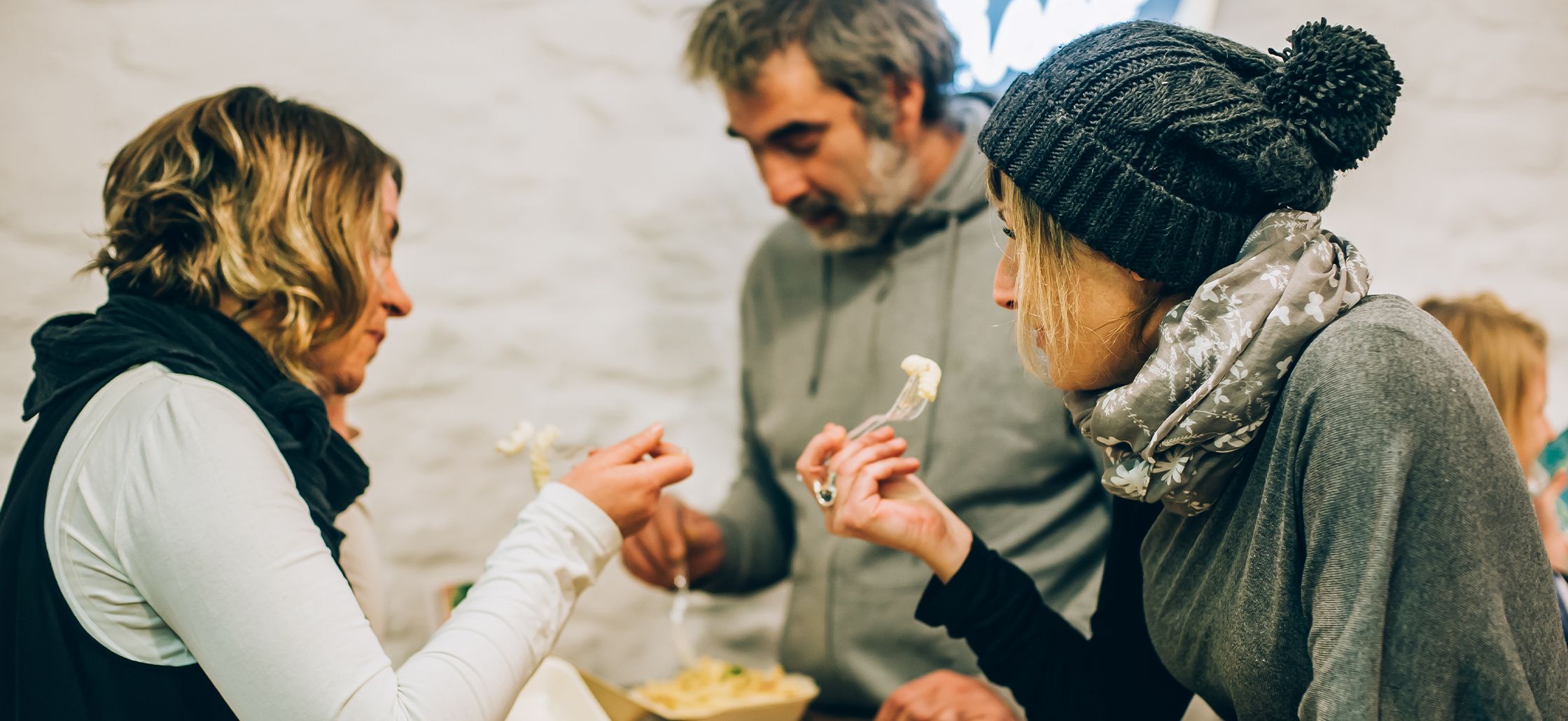 people eating takeaway in a group of three