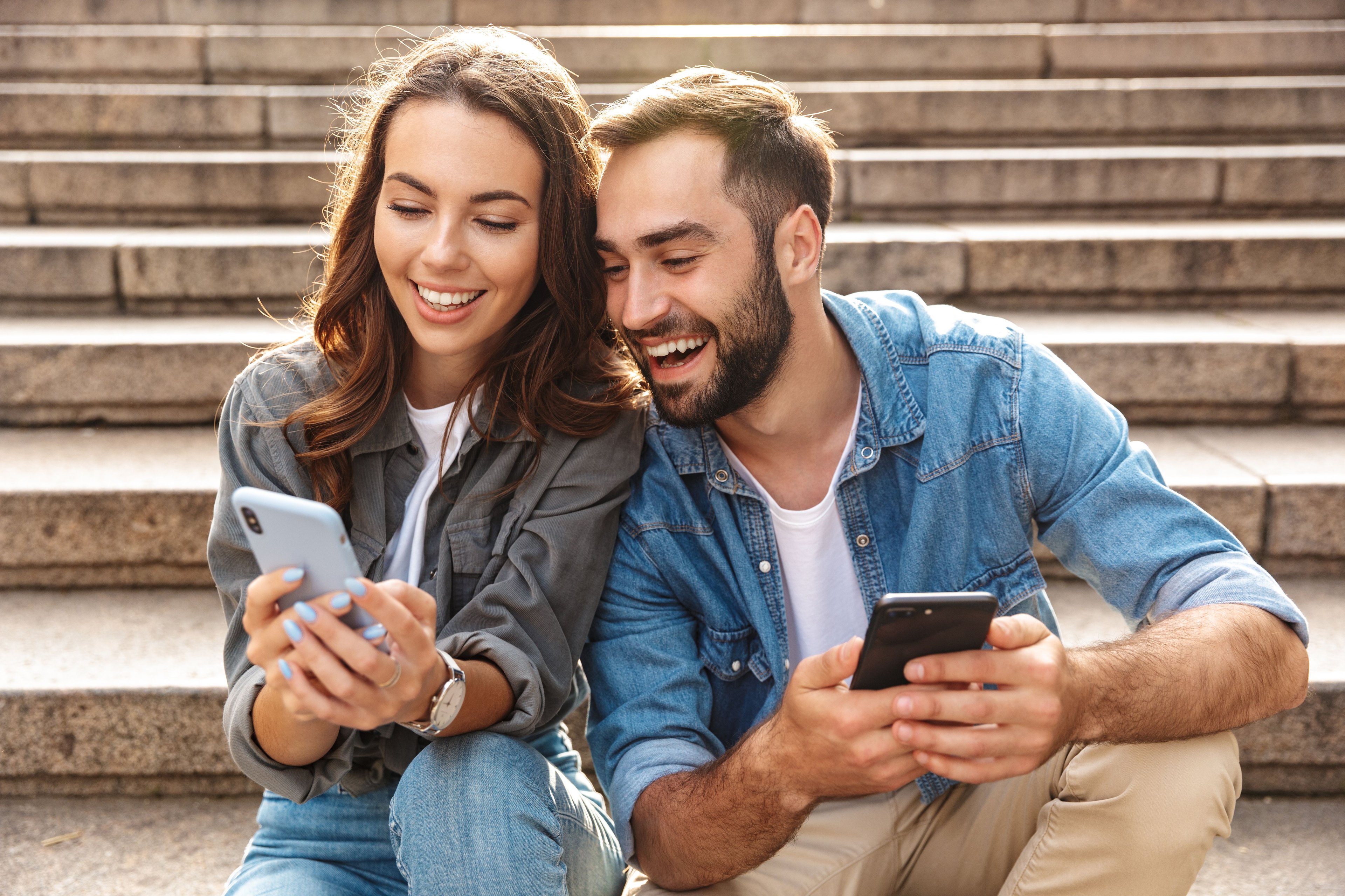 Couple shopping on mobile phones