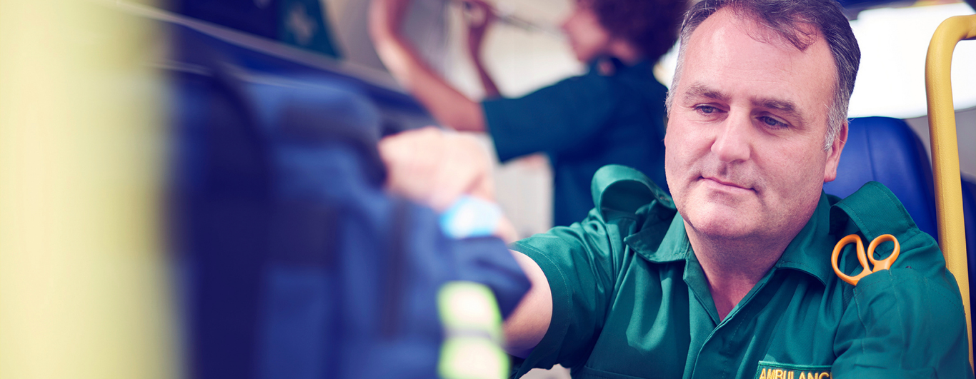 Emergency Services banner image showing Ambulance worker